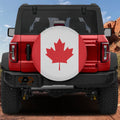 Canadian Maple Leaf flag spare tire cover mounted on red Ford Bronco rear with red rock canyon backdrop