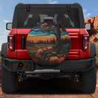 Quilted stitched Halloween pumpkin patch spare tire cover with backup camera hole on Jeep Wrangler