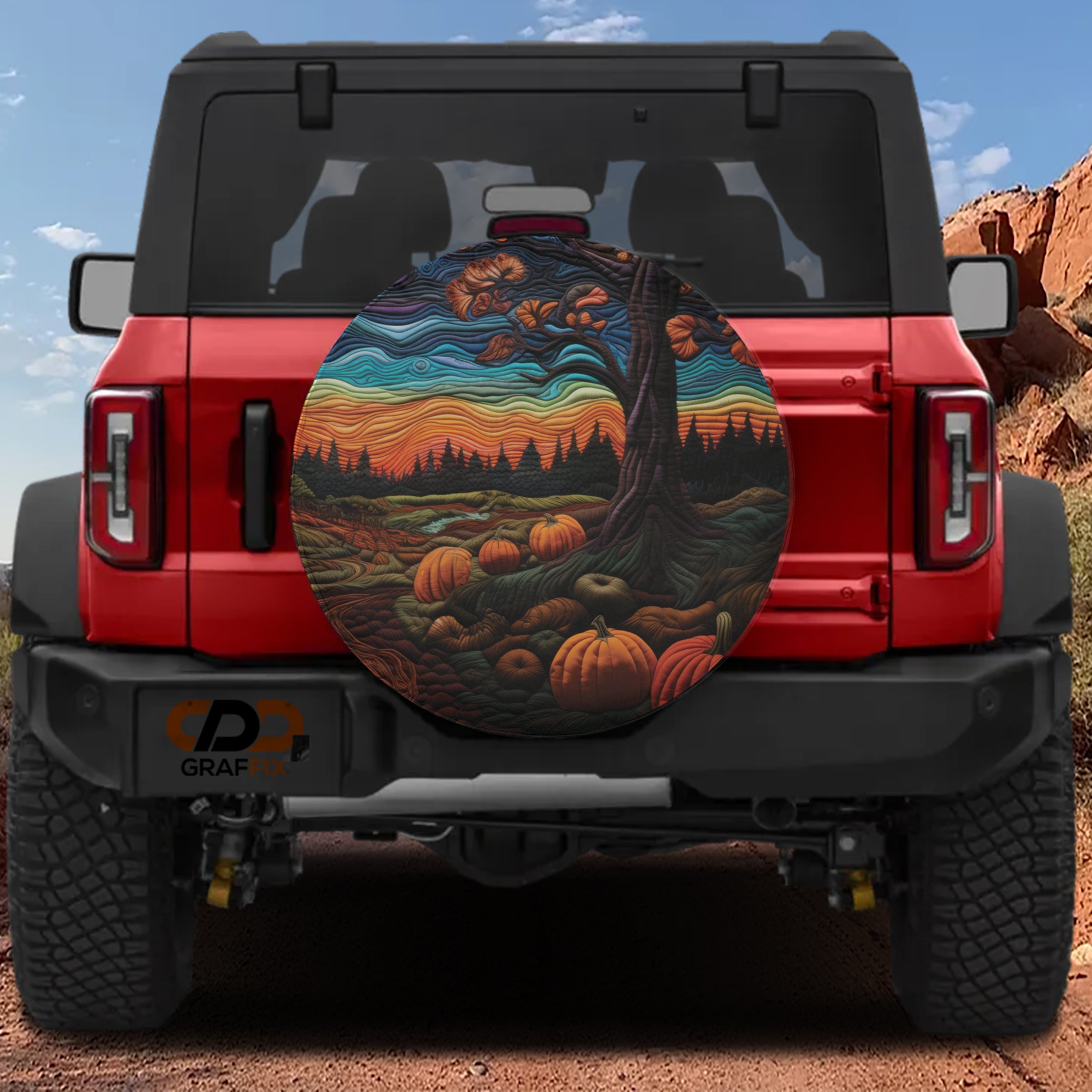 Quilted stitched Halloween pumpkin patch spare tire cover with backup camera hole on Jeep Wrangler