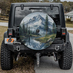 the rear of a black Jeep Wrangler with a large decal of a mountain landscape on the rear window.