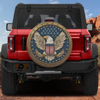 American Freedom Seal spare tire cover on a red Jeep Wrangler featuring the bald eagle and flag emblem on the rear