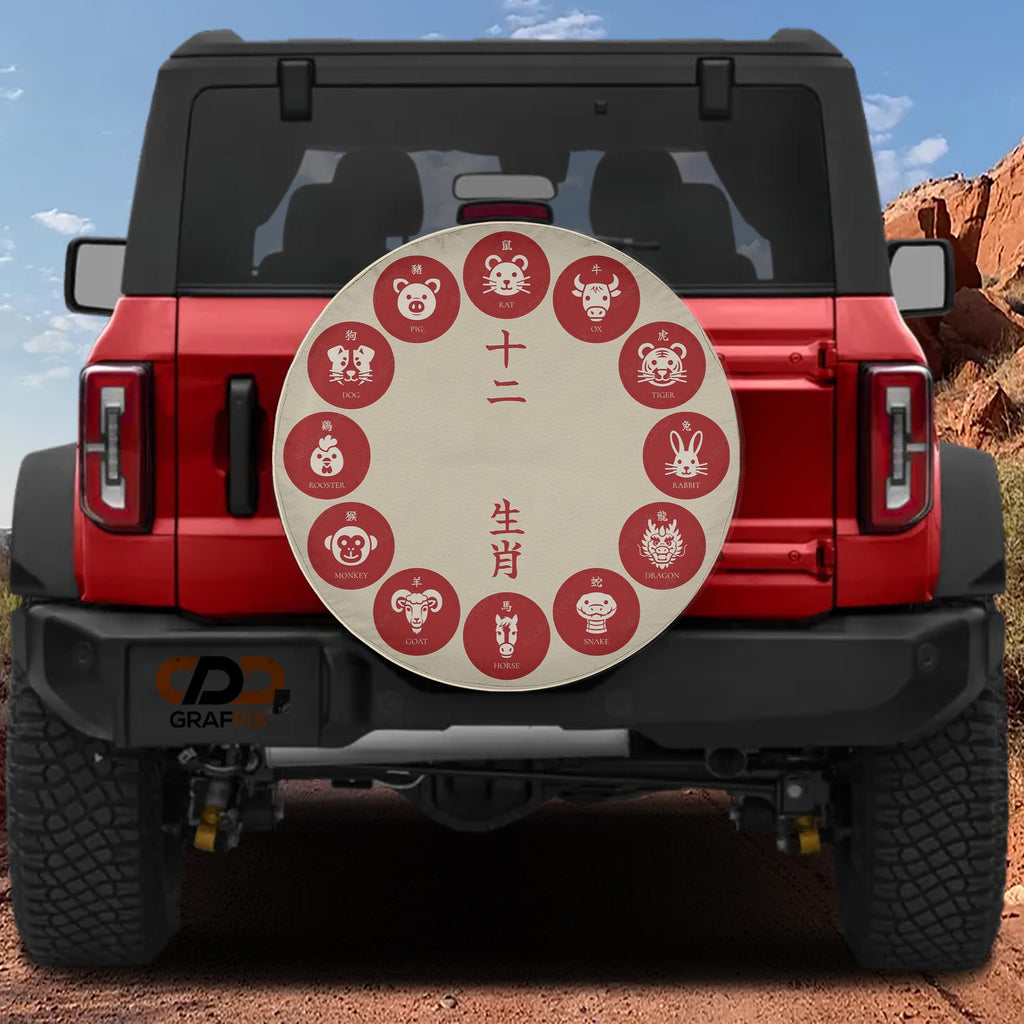 A red Jeep Wrangler with a round decal on the rear window, featuring various Chinese zodiac animals.