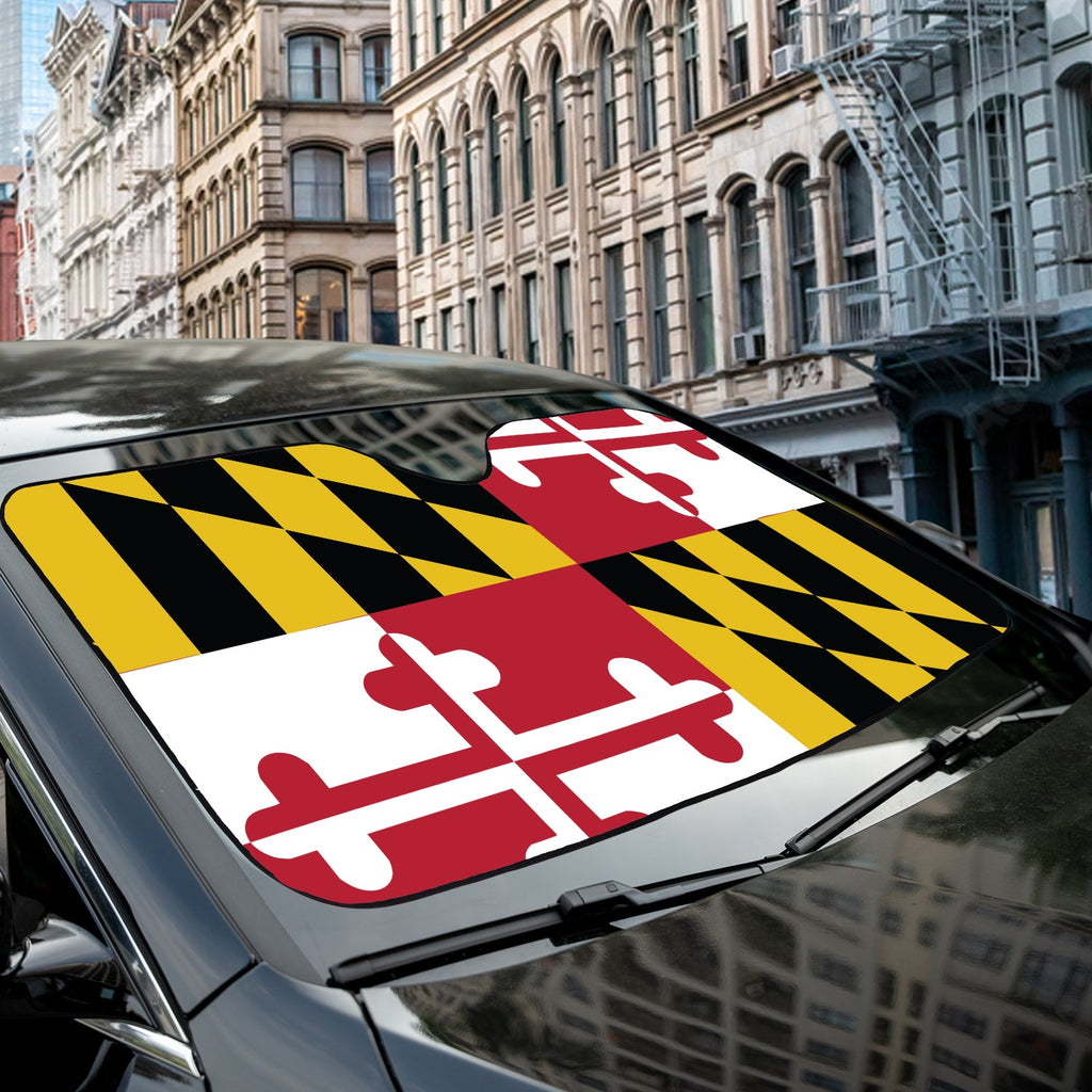 Maryland State Flag accordion sunshade close-up installed on a dark sedan windshield exterior detail view