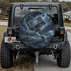 a black Jeep Wrangler with a large, detailed decal of a hammer on the rear window.