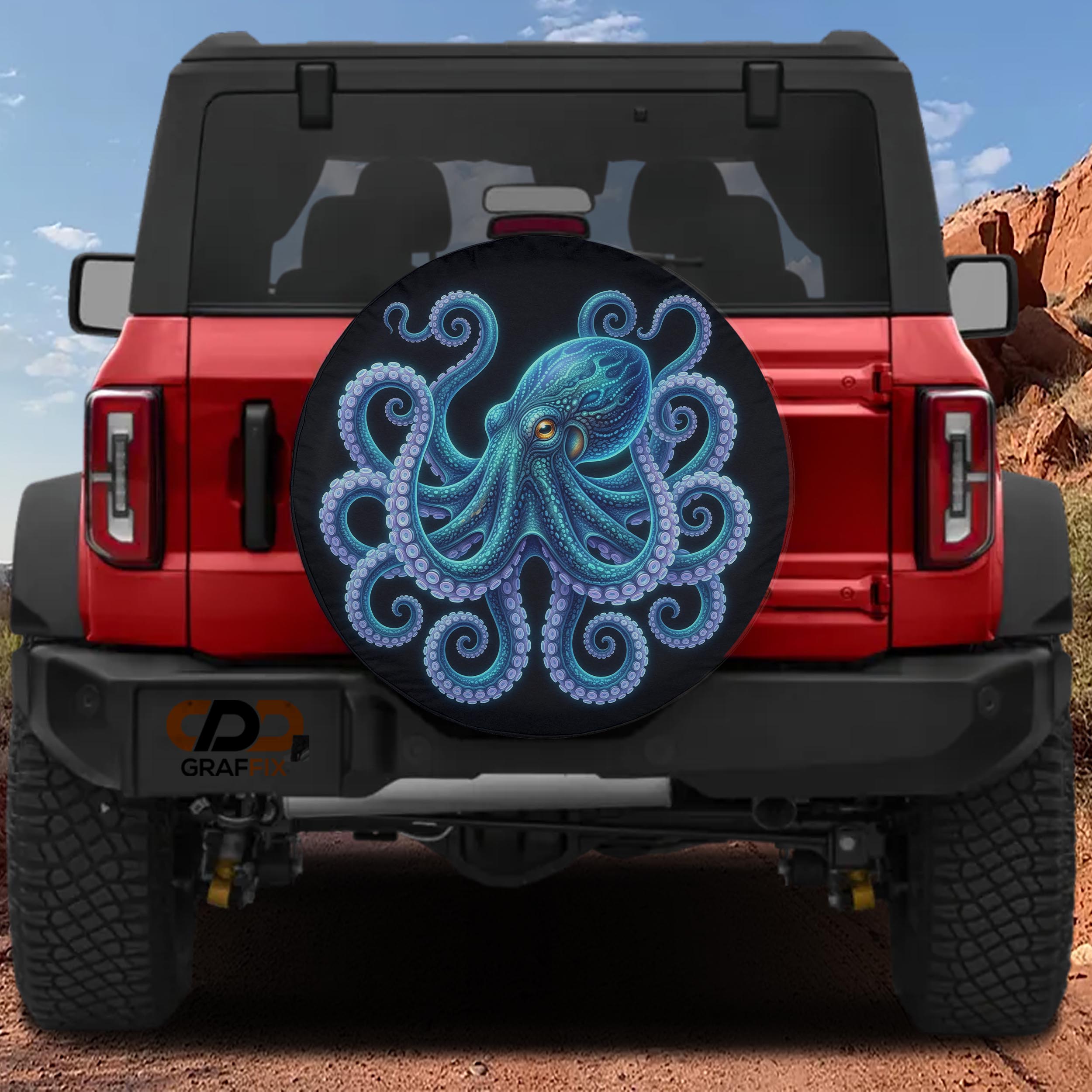 a red Jeep Wrangler with a large octopus-themed spare tire cover on the rear.