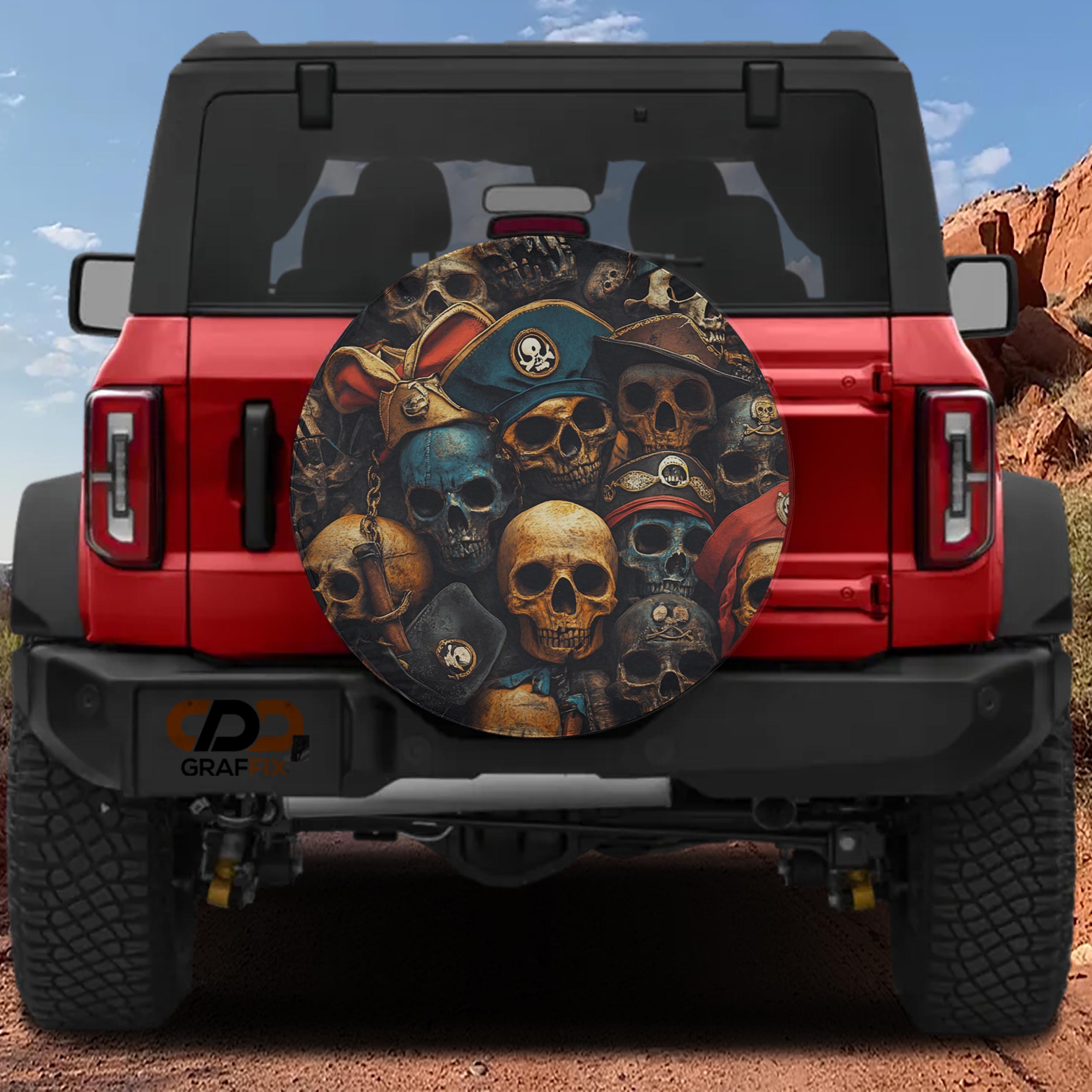 Pirate skulls spare tire cover on red Ford Bronco with stacked weathered skulls in tricorn pirate hats