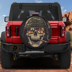 Burning reflections army skull spare tire cover on a black Jeep Wrangler with GRAFFIX bumper sticker