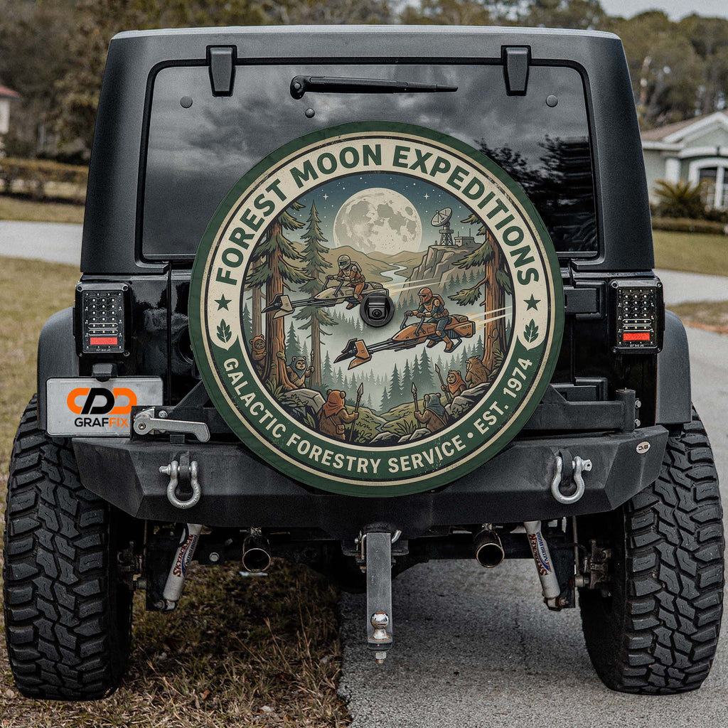 the back of a black Jeep Wrangler with a large circular decal on the rear window, featuring a forest scene with a full moon and stars.