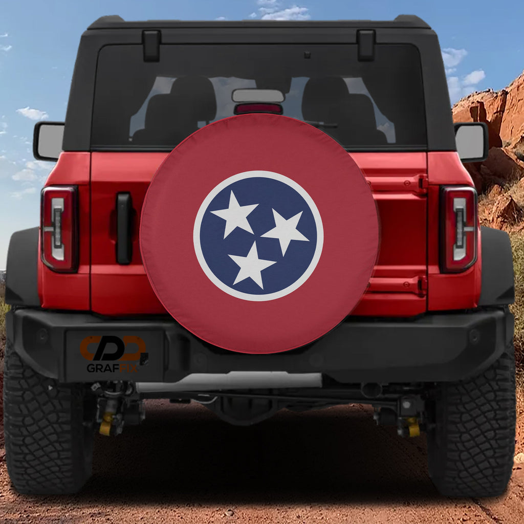 Tennessee state flag spare tire cover mounted on red Ford Bronco rear with red rock canyon backdrop