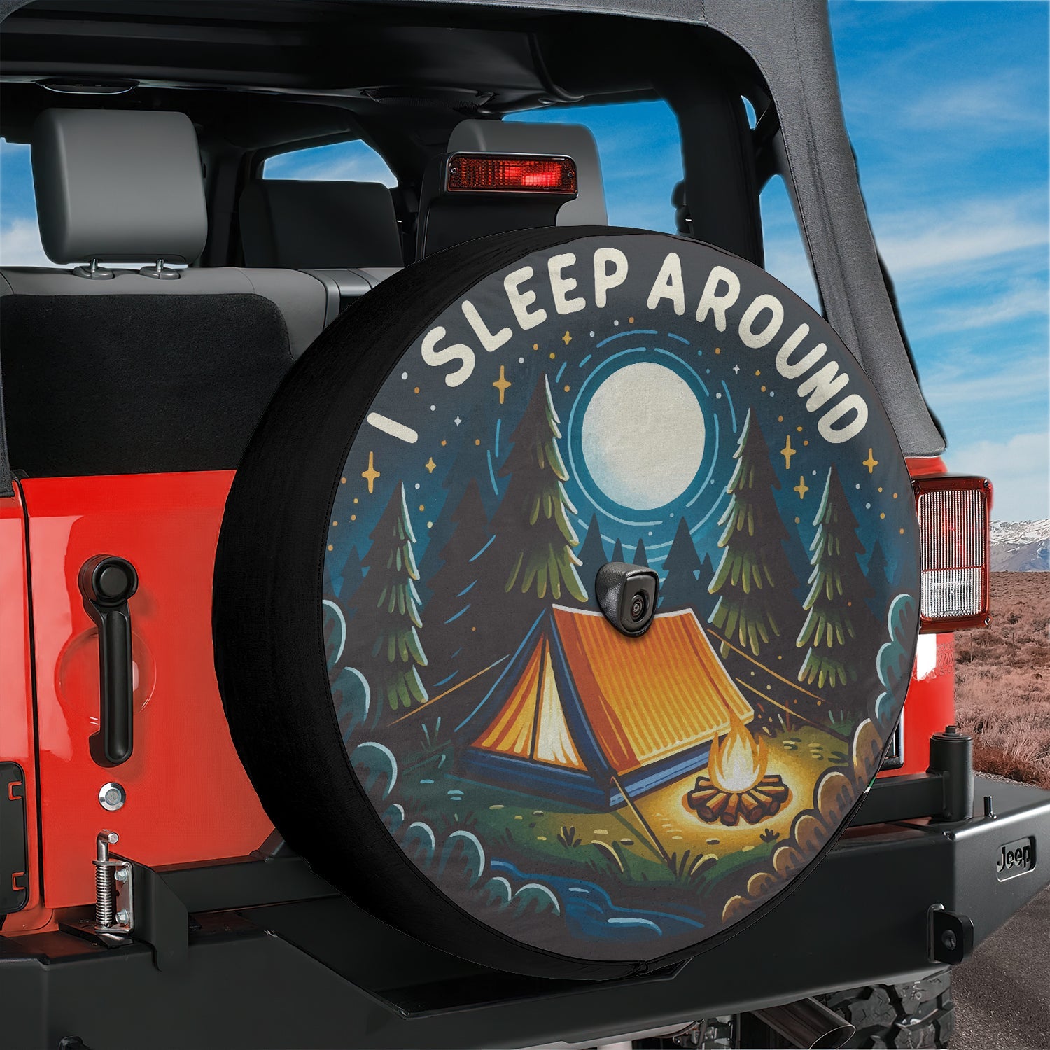 I sleep around camping edition tire cover on a red Jeep Wrangler with tent campfire pines camera hole