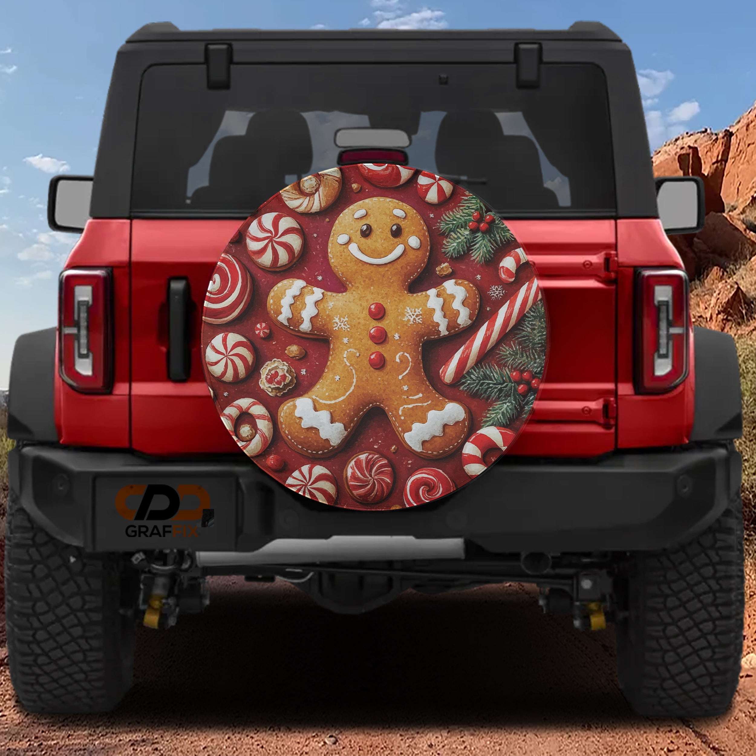 Red Ford Bronco rear with gingerbread cookie man tire cover featuring peppermints and candy canes