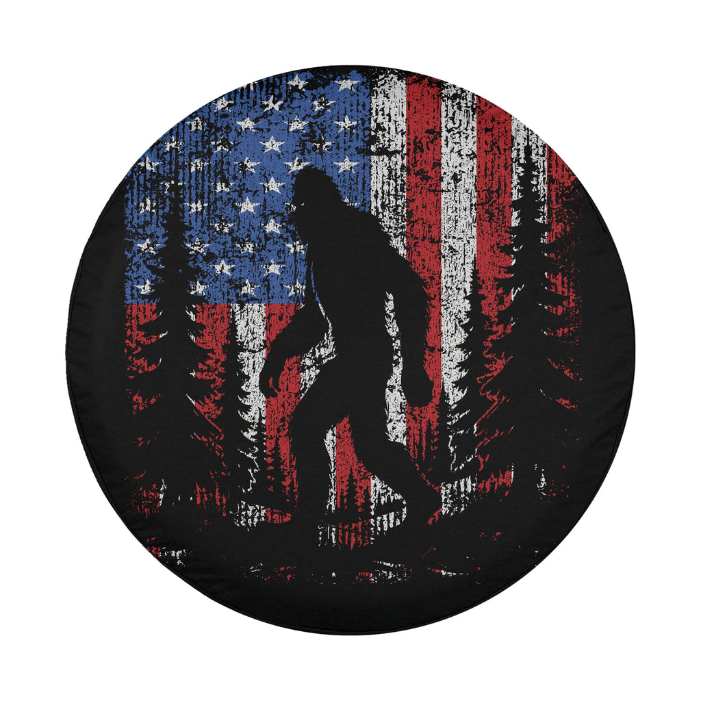 Lifestyle shot of Bigfoot Across America tire cover mounted on Jeep Wrangler outdoor scene