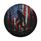 Lifestyle shot of Bigfoot Across America tire cover mounted on Jeep Wrangler outdoor scene