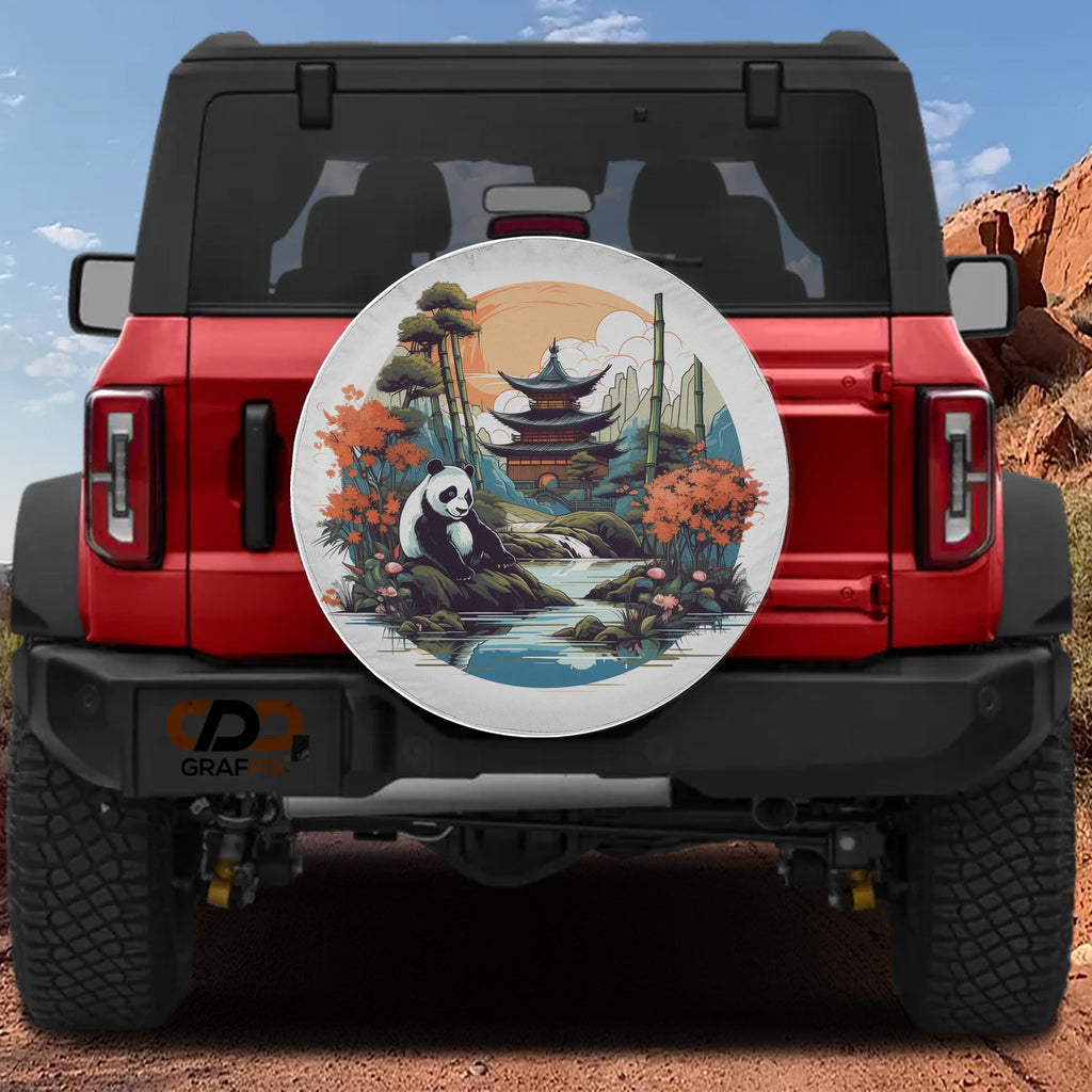 A red Jeep Wrangler with a large, decorative wheel cover featuring a panda bear and a scenic landscape.