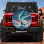 Aurora Wolf spare tire cover on a red Bronco rear with a howling wolf under teal northern lights