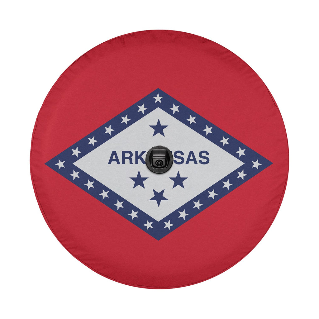 Arkansas state flag spare tire cover mounted on red Ford Bronco rear against red rock canyon scenery