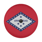 Arkansas state flag spare tire cover mounted on red Ford Bronco rear against red rock canyon scenery