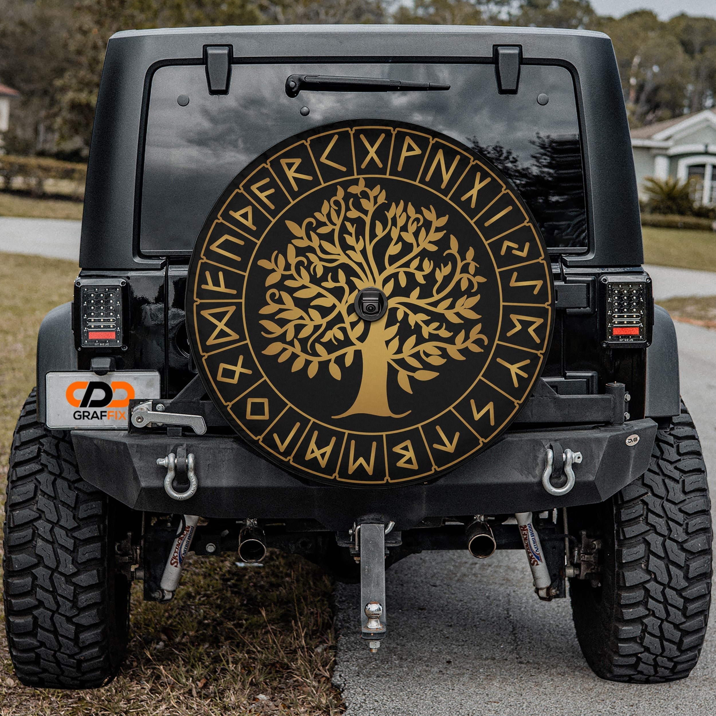 Black Jeep displaying Yggdrasil Norse rune spare tire cover with backup camera cutout installed