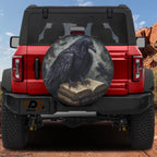 Huginn's Black Raven Tome spare tire cover alternate flat view of magical grimoire with perched black raven design