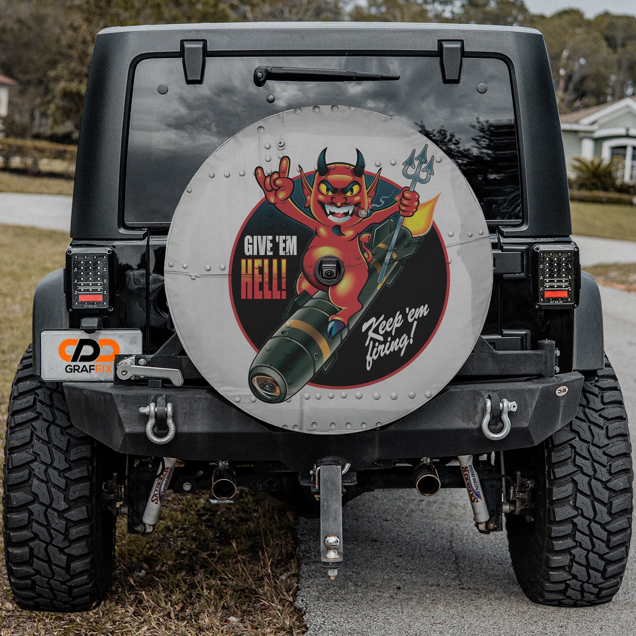 Give Em Hell Vintage Bomber tire cover on black Jeep Wrangler with GRAFFIX license plate