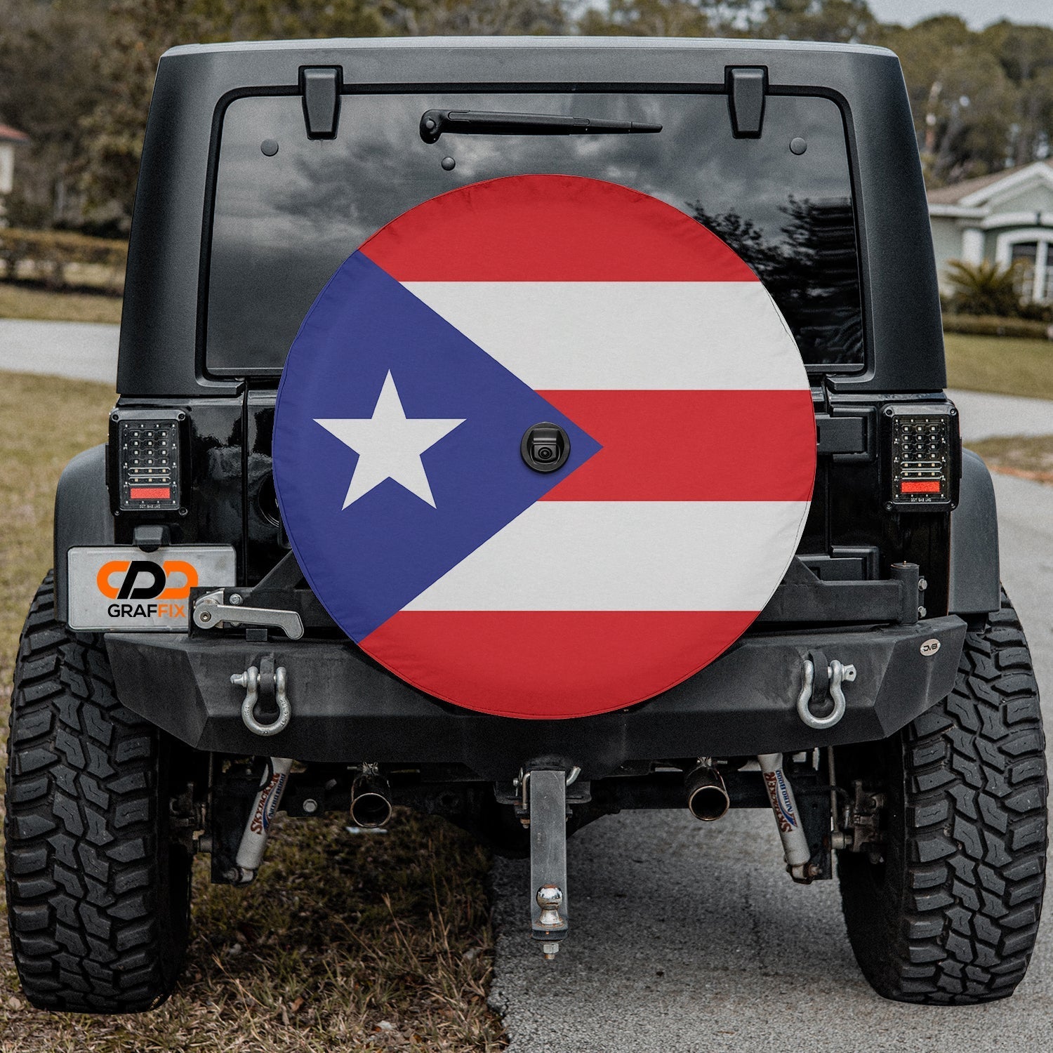 Puerto Rico Flag spare tire cover on black Jeep Wrangler rear with red white stripes and blue triangle