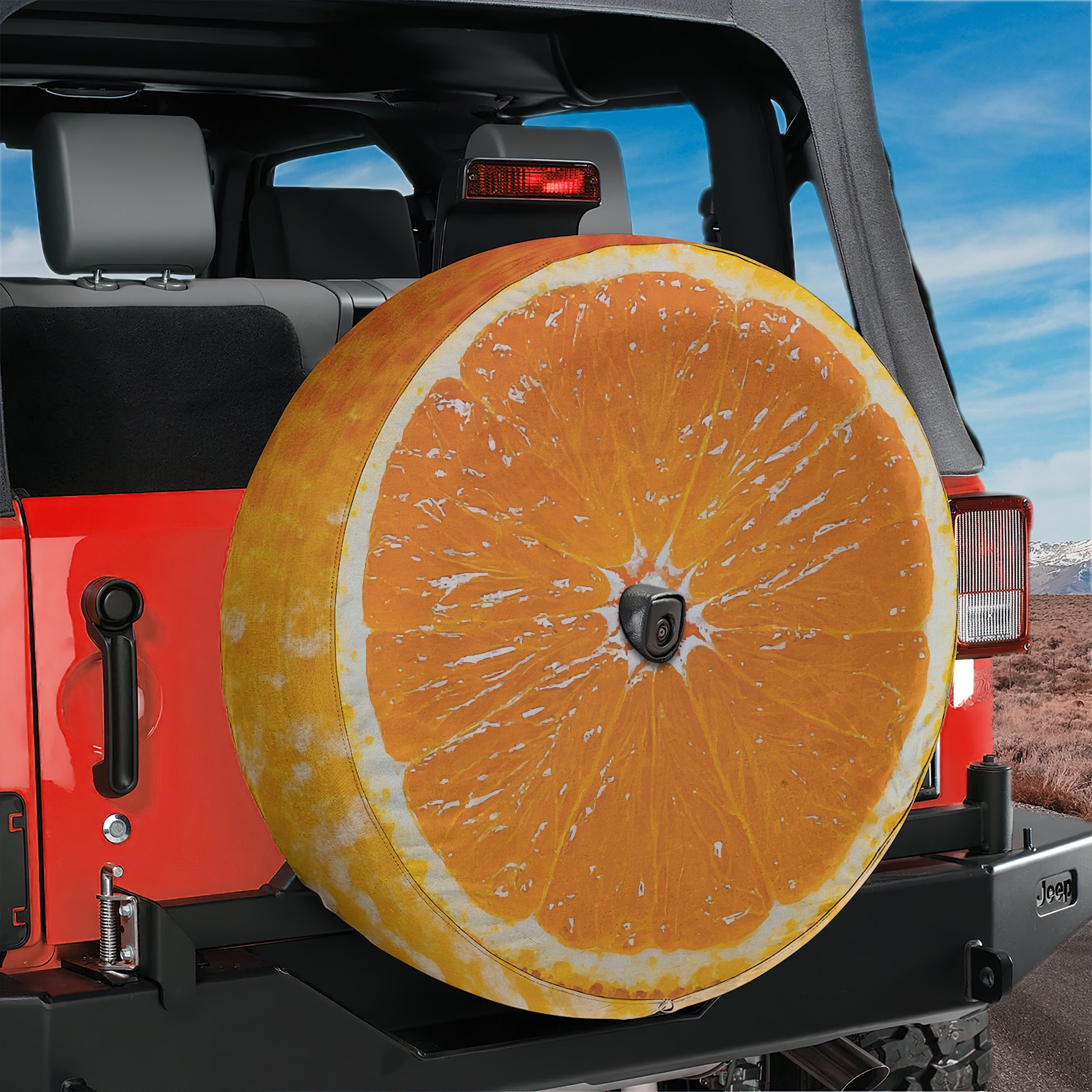 Orange fruit spare tire cover with vibrant citrus slice graphic and bright orange peel design