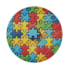 Spectrum of Unity spare tire cover round design featuring multicolor autism awareness puzzle pieces
