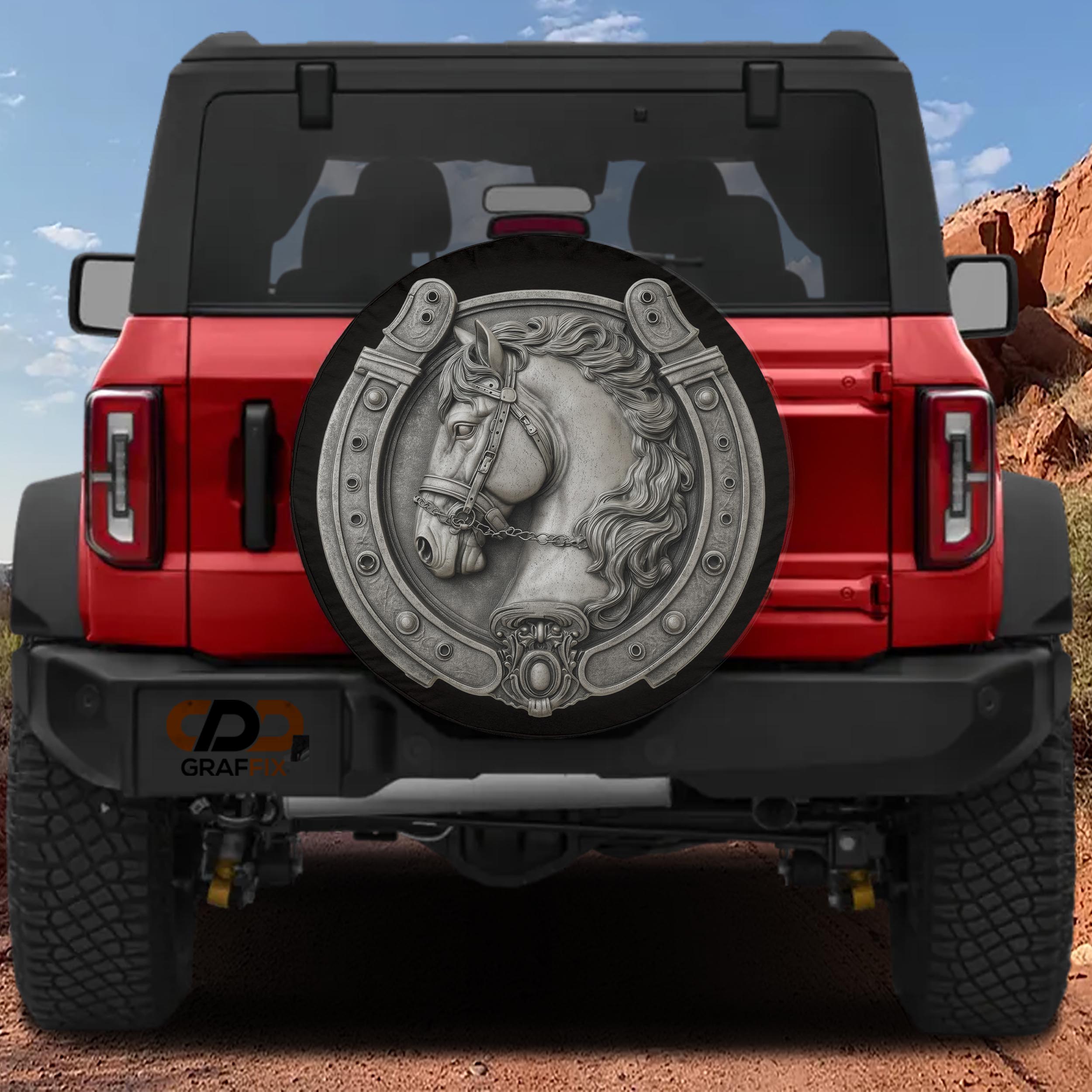 the rear of a red Jeep Wrangler with a silver horseshoe-shaped spare tire attached to the vehicle.