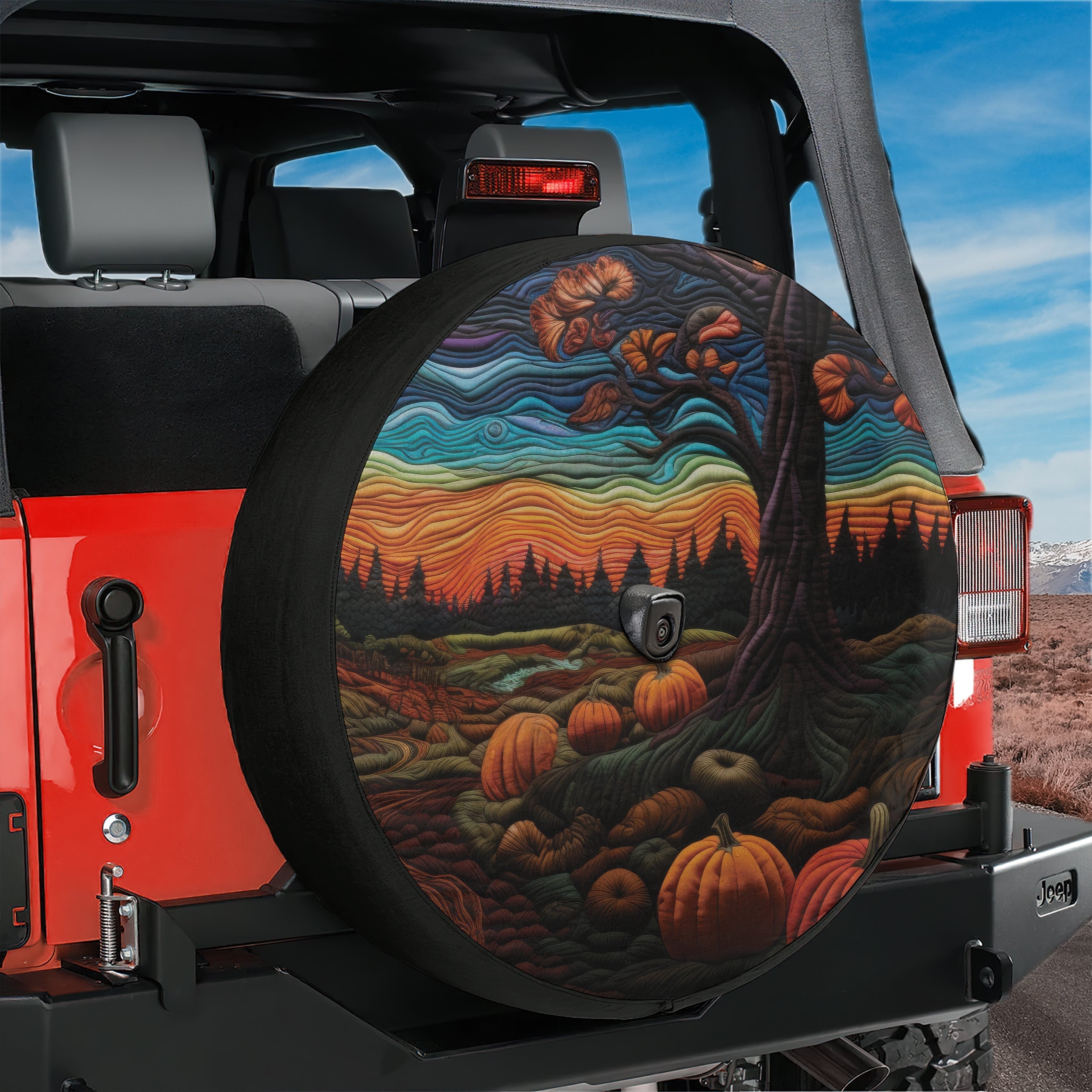 Halloween pumpkin patch spare tire cover lifestyle shot mounted on rear of Jeep at dusk