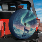 Aurora Wolf spare tire cover installed on a red Jeep Wrangler hatch with howling wolf below the dancing aurora