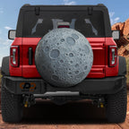 Dark Side of the Moon spare tire cover on black Jeep Wrangler showing gray cratered moon print