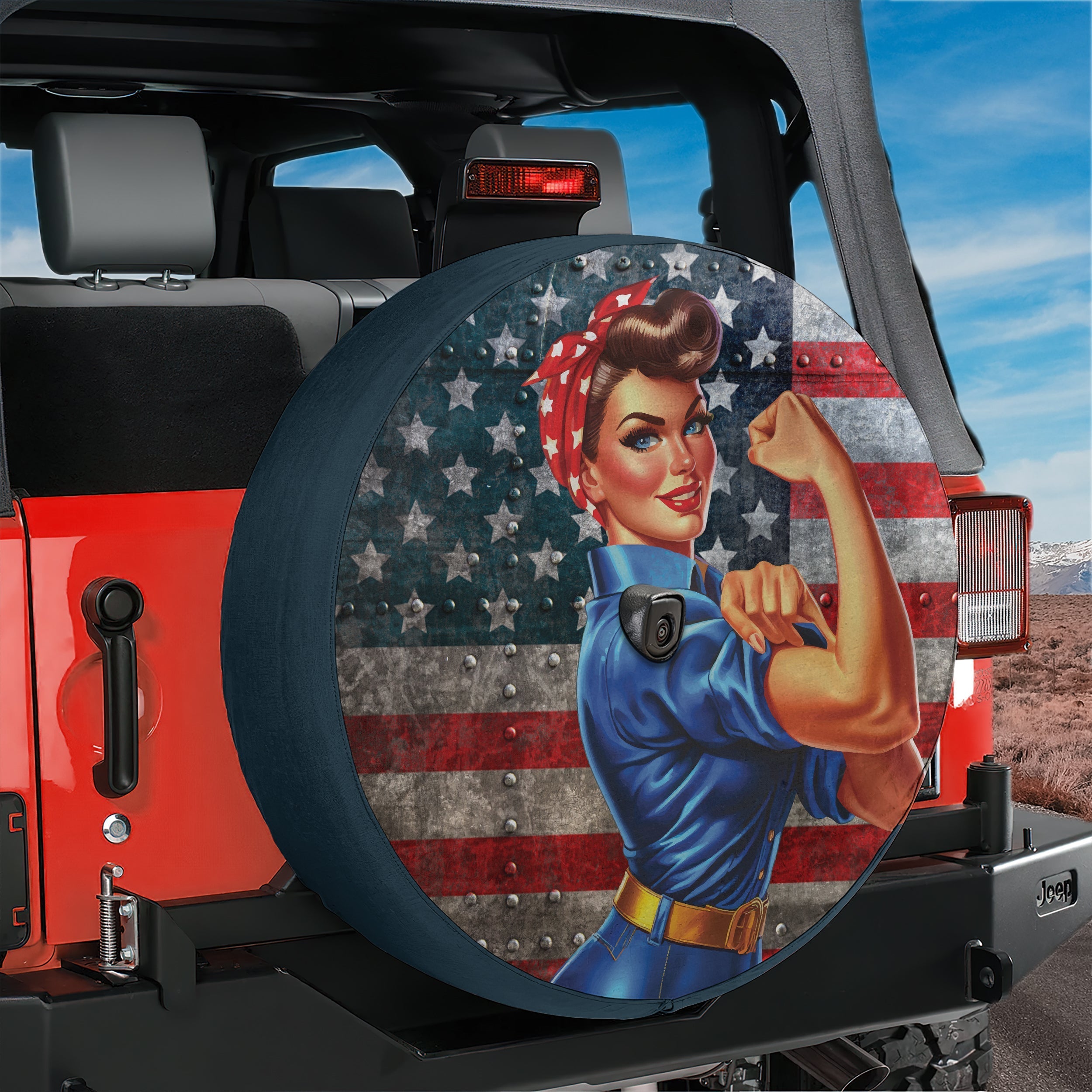 WWII Labor Woman spare tire cover with patriotic Rosie design shown on red Jeep Wrangler back