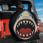 Shark Bite spare tire cover on black Jeep Wrangler with shark face and open jaws print