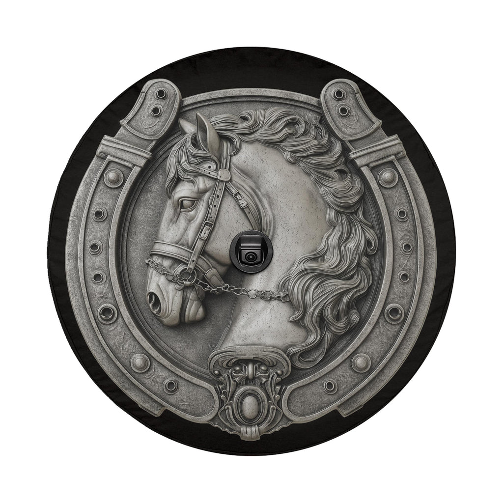 A decorative metal horseshoe with a detailed horse head design, featuring a chain and a small black object.