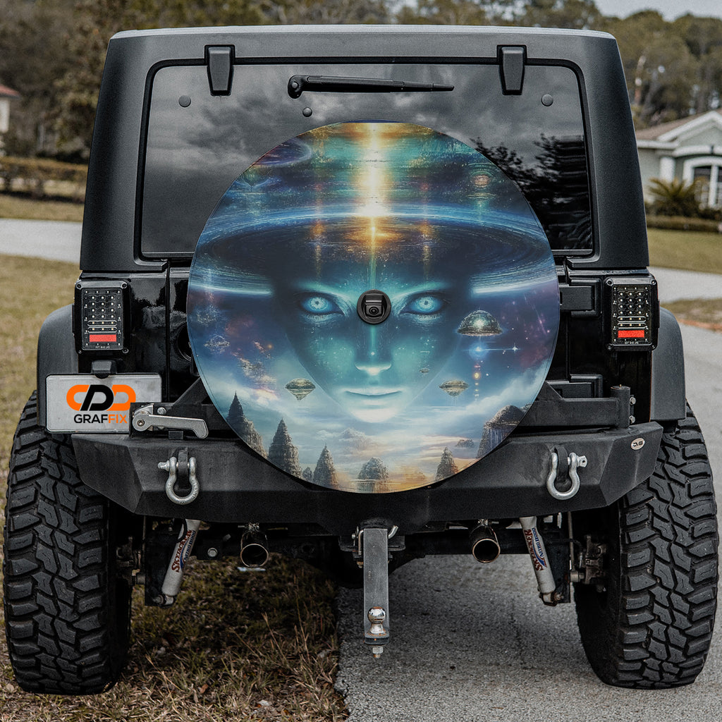 Alien Enlightenment spare tire cover on black Jeep Wrangler rear showing cosmic art with camera cutout hole