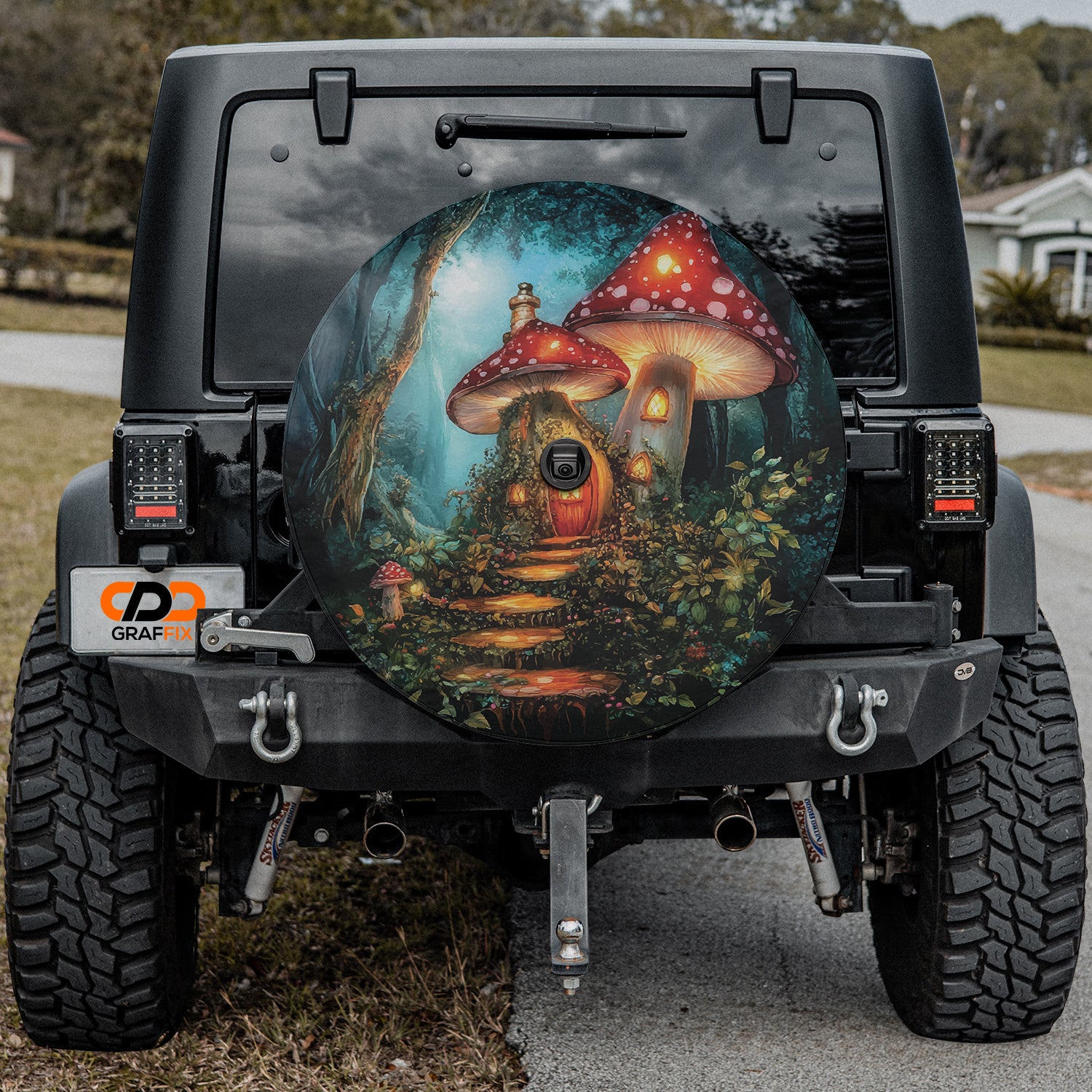 Enchanted Mushroom Cottage spare tire cover on a black Jeep Wrangler showing the fairytale mushroom-house artwork