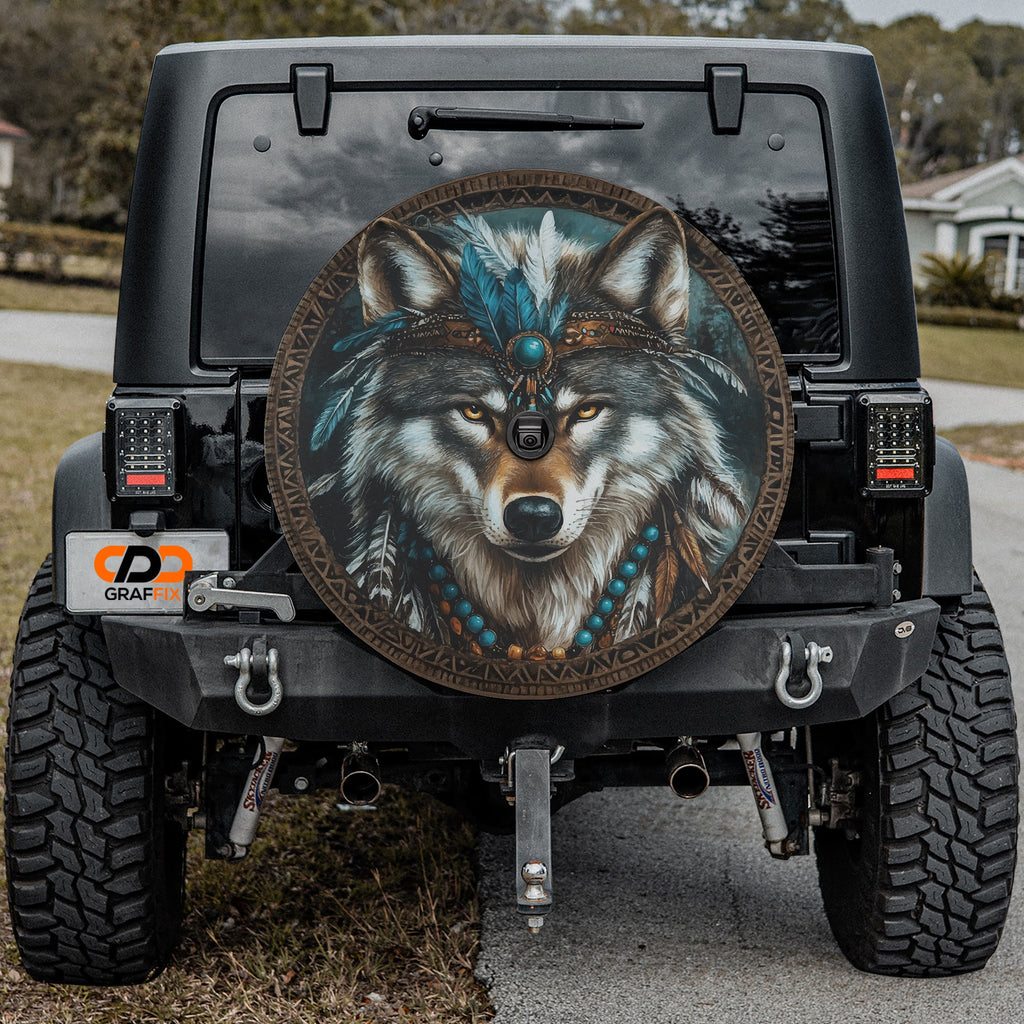 Native American turquoise wolf spare tire cover mounted on black Jeep Wrangler rear