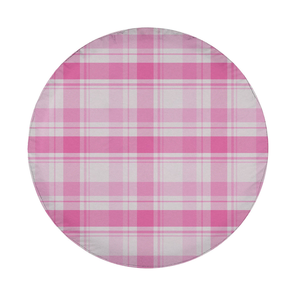 A round, white object with a pink and white plaid pattern.