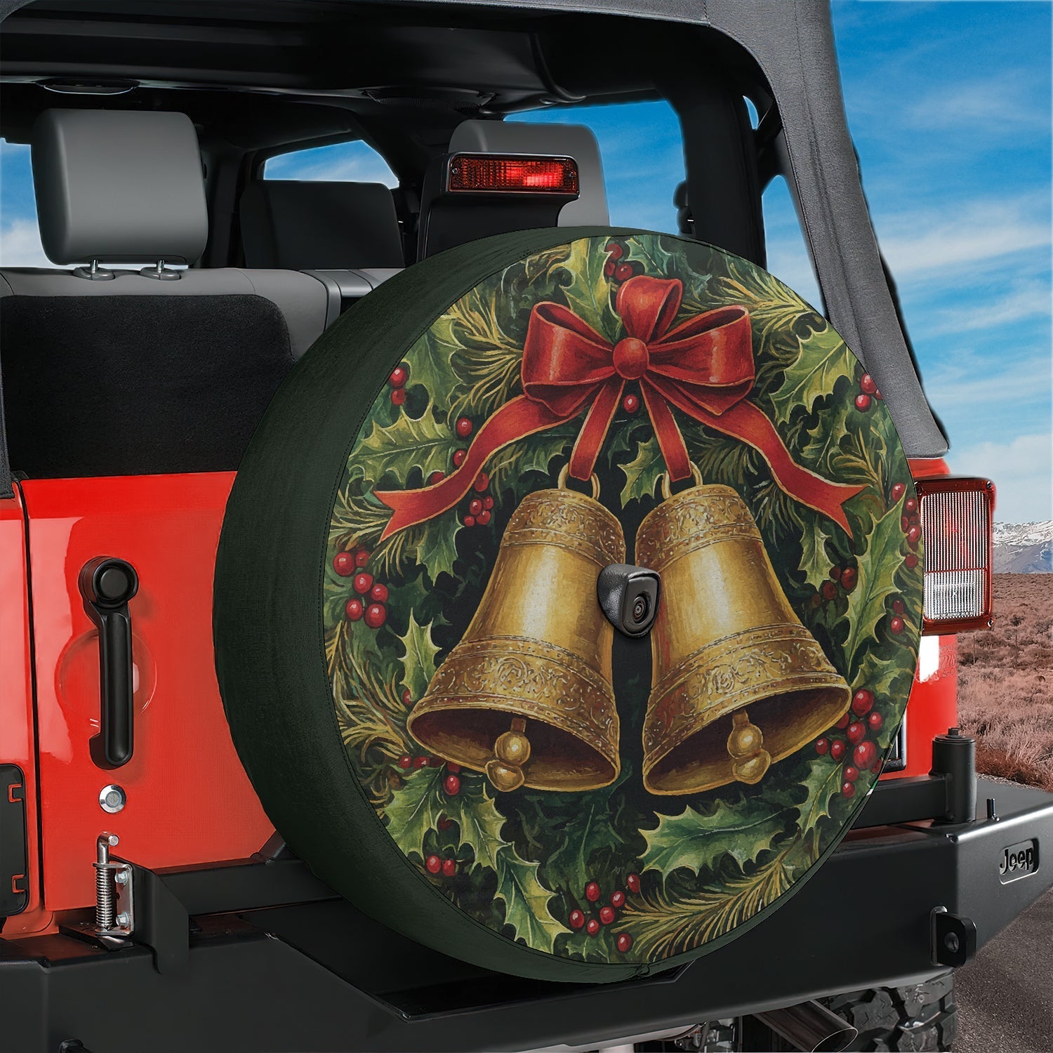 Christmas wreath with twin golden jingle bells spare tire cover shown on a black Jeep Wrangler