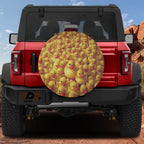 Rubber Duck Army spare tire cover installed on a red Bronco rear hatch with a crowd of yellow rubber ducks
