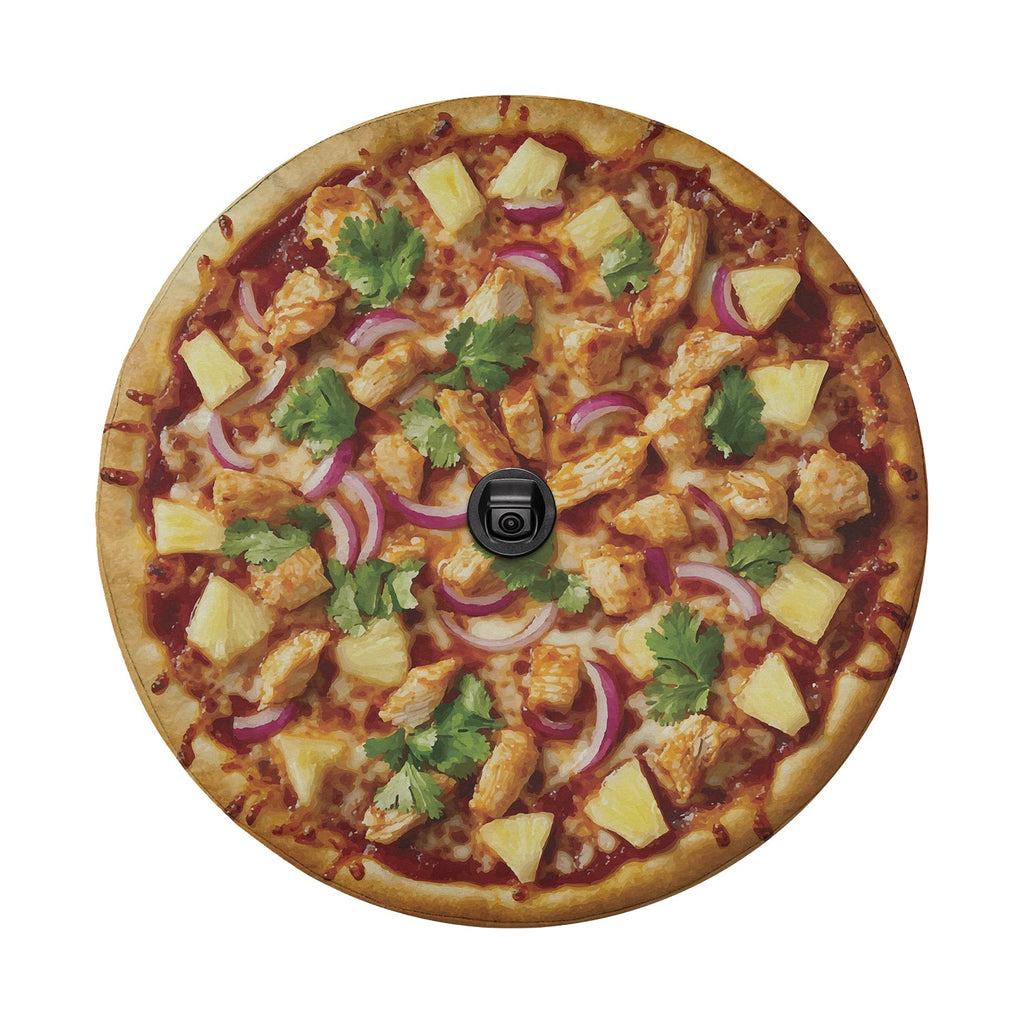 BBQ chicken pizza spare tire cover product mockup on red Ford Bronco with desert backdrop scene