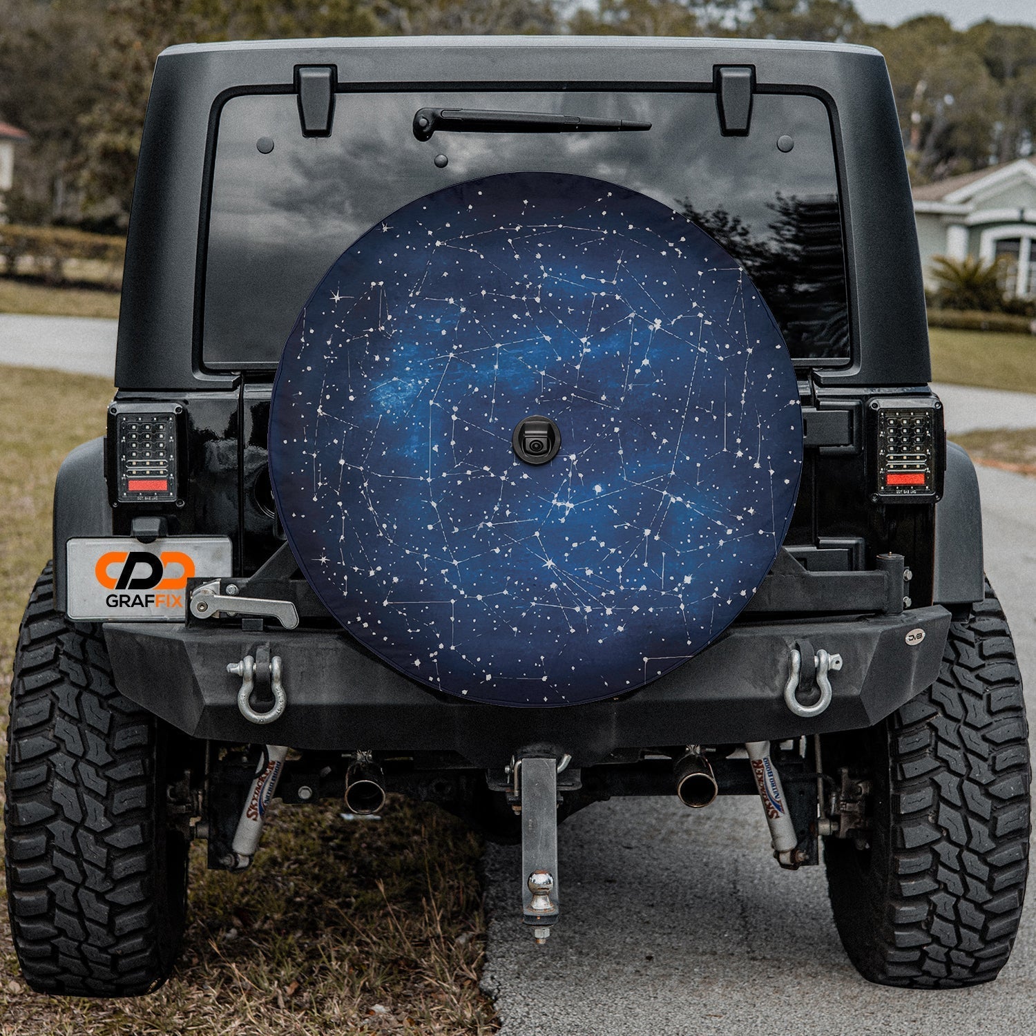 Constellation Star Map spare tire cover installed on black Jeep Wrangler with camera cutout center