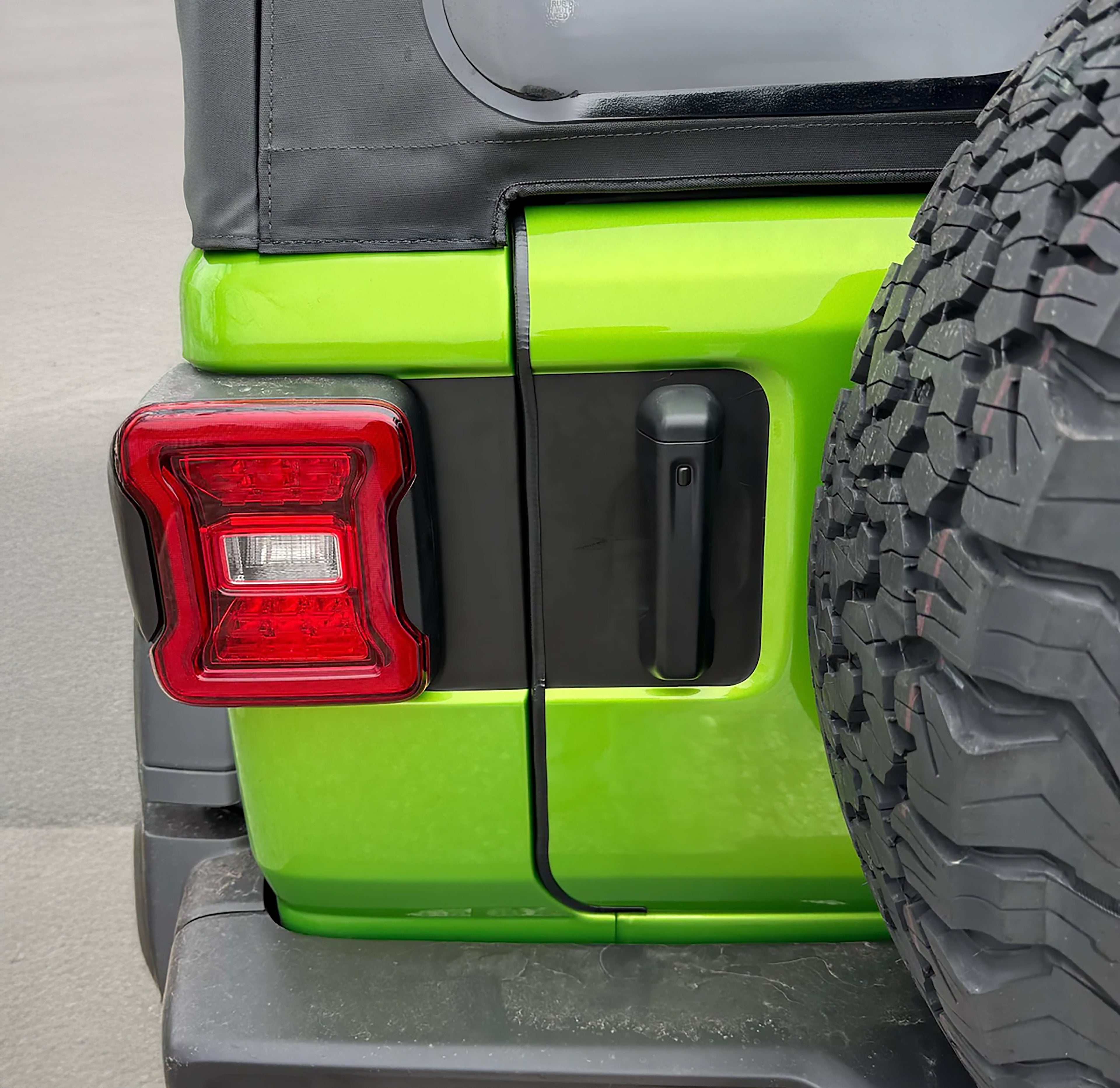 JL rear door tailgate blackout vinyl decal installed on lime green 2018-2025 Jeep Wrangler JL