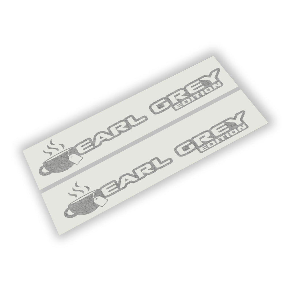 Pair of Earl Grey Edition fender vinyl decals with teacup and steam icon shown flat on white backing paper