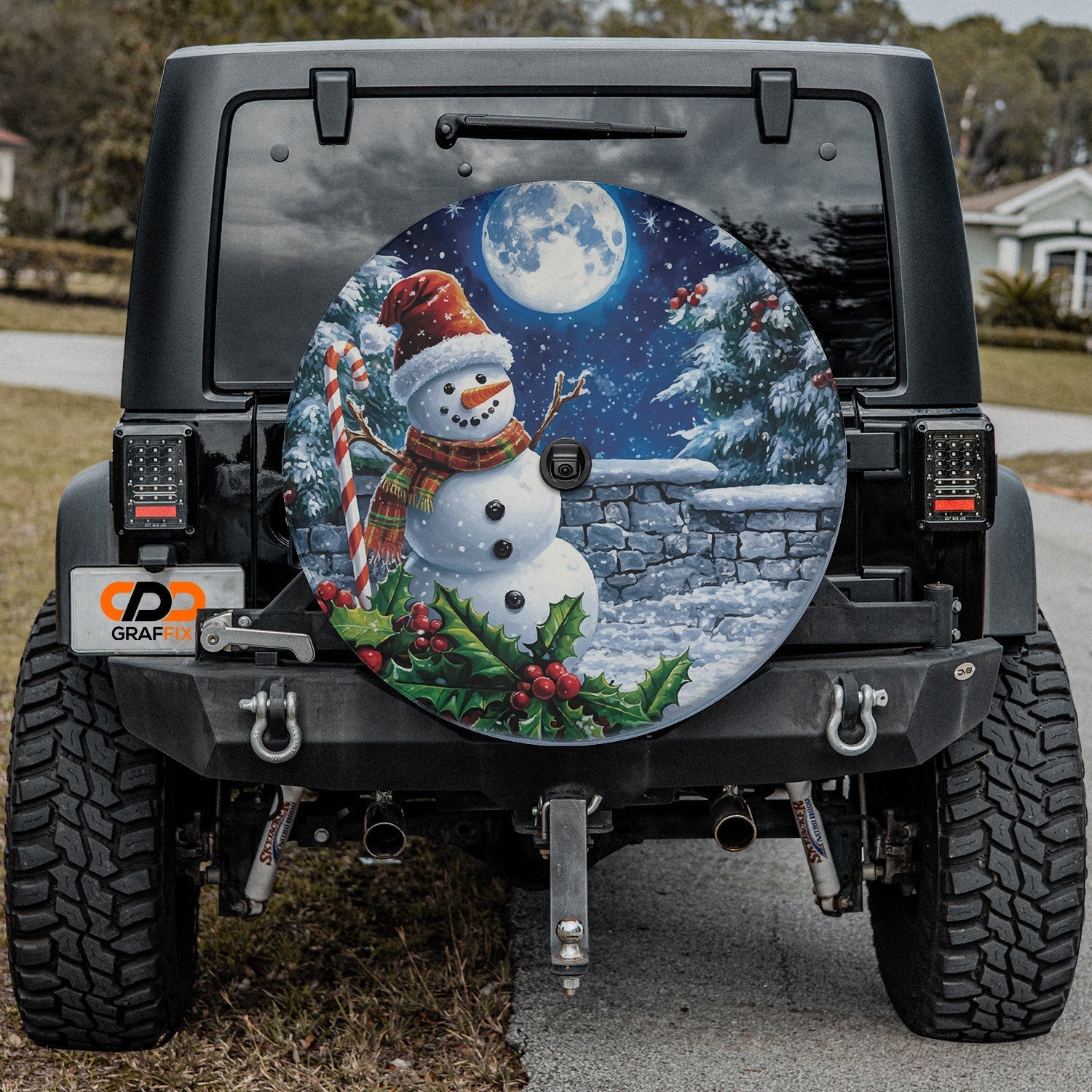Frostys Midnight Cheer tire cover installed on black Jeep Wrangler with center camera cutout port