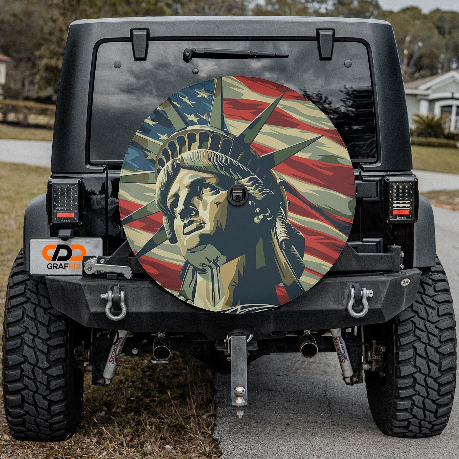 Statue of Liberty patriotic spare tire cover displayed on a Jeep Wrangler with stars and stripes
