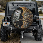 Yin-Yang Owls spare tire cover mounted on a Jeep Wrangler rear wheel with the mystical paired owls in soft light