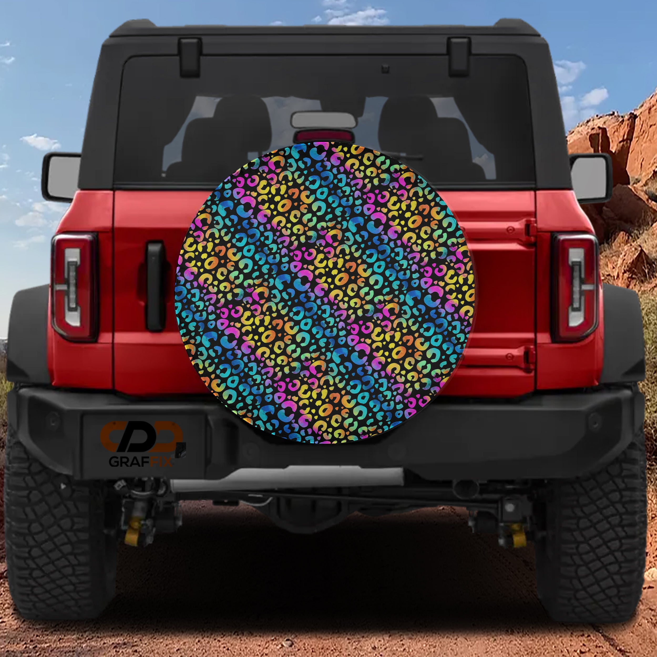 Leopard rainbow print spare tire cover on red Bronco rear in vivid neon colorful pattern