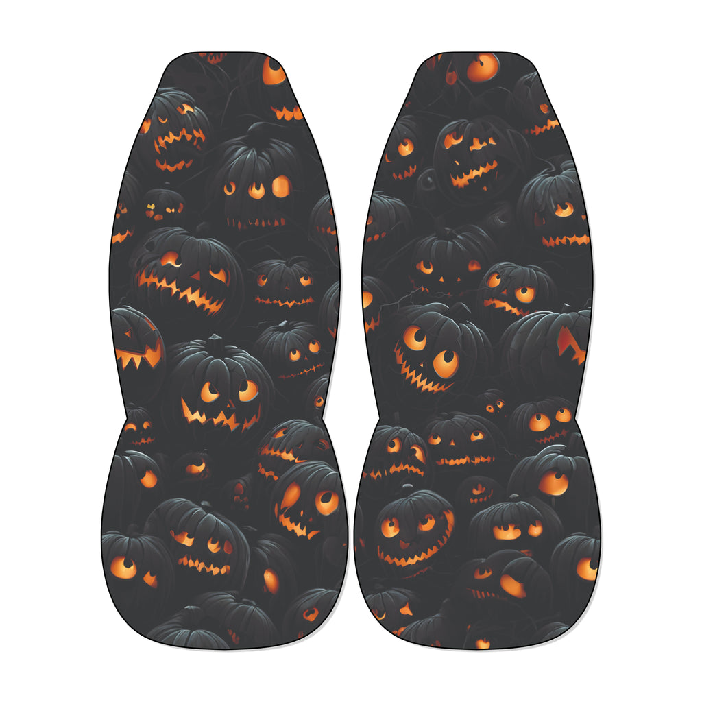 a pair of black shoes with a repeating pattern of orange and black jack-o'-lantern faces on the soles.