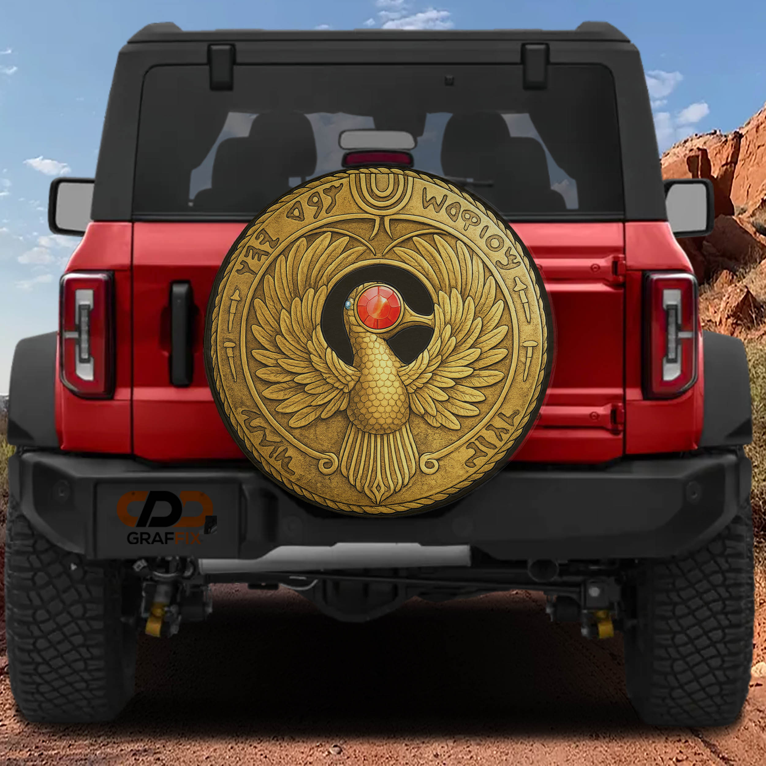 A red Jeep Wrangler with a large gold-colored shield or emblem on the rear window.